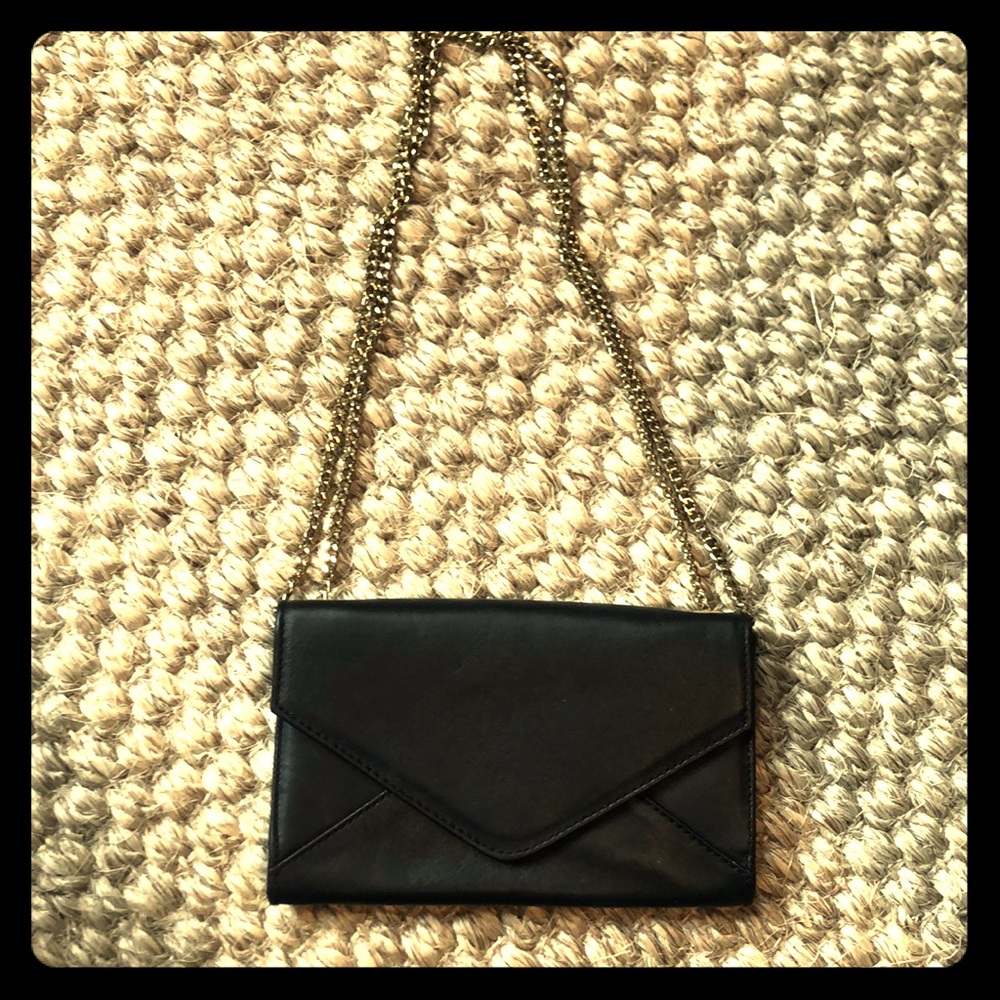 Barney’s New York black and gold clutch